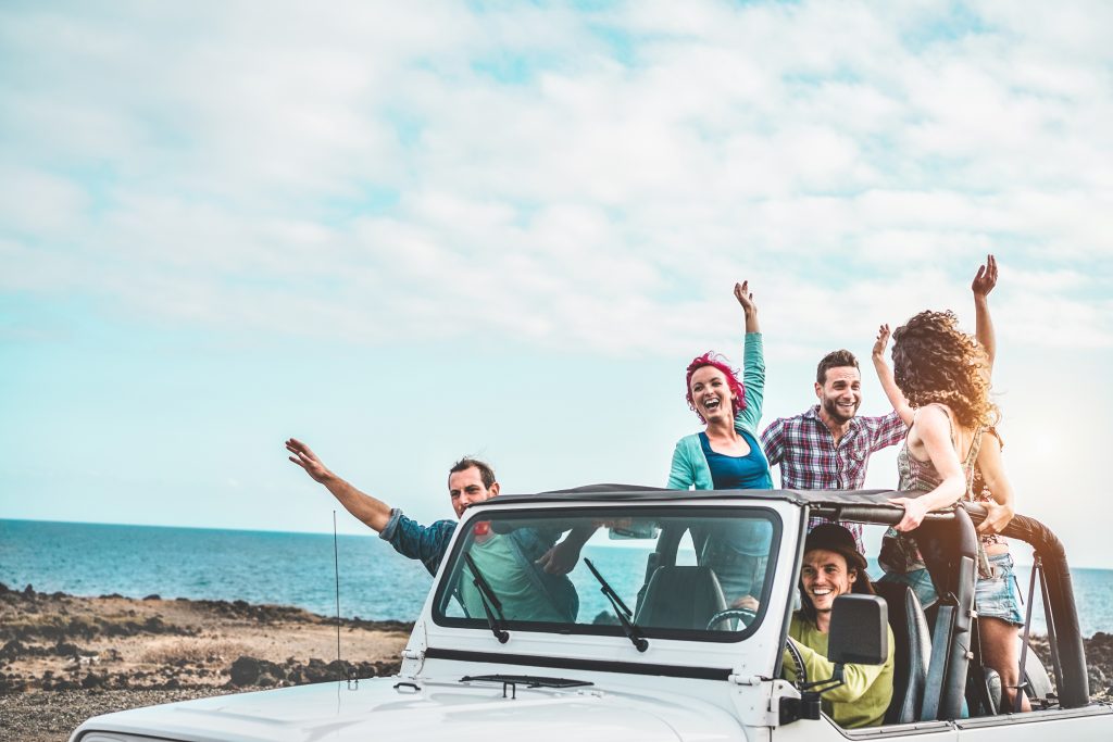 Jeep full of people waving